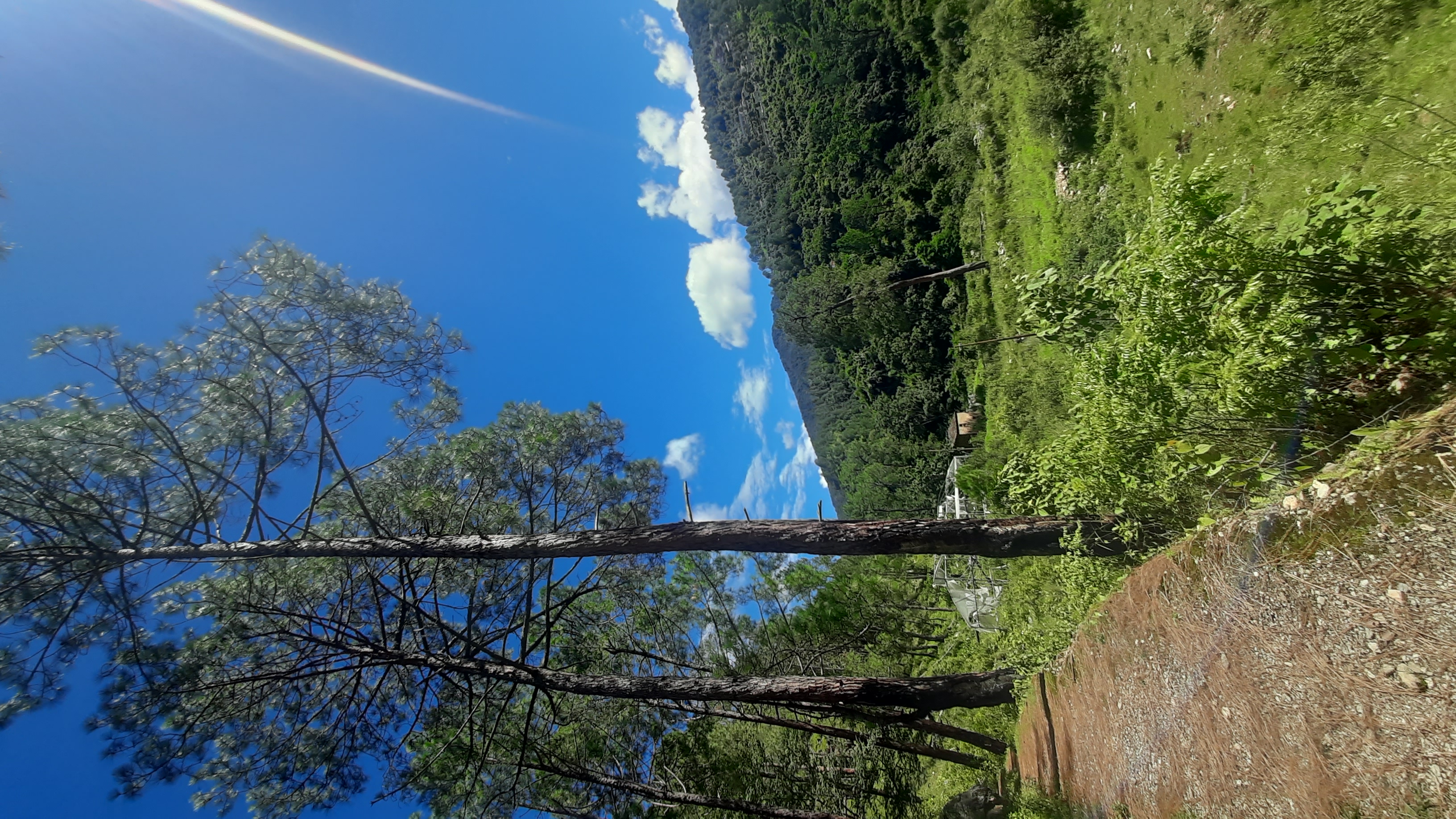 Panoramic hills under blue skies